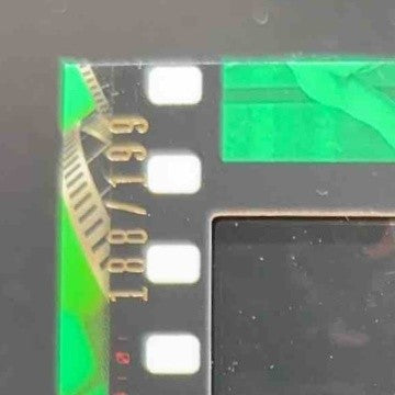 2021 Topps WWE Hulk Hogan vs. Ultimate Warrior Match Film Strips Light Green/199 - Sports Cards