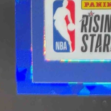 2023-24 Hoops Premium Stock Brandin Podziemski Rising Stars Blue Ice Prizm/99 RC