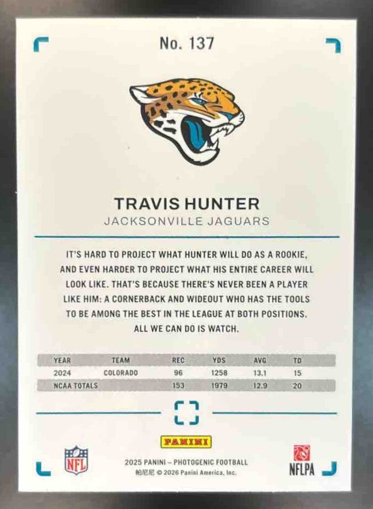 2025 Panini PhotoGenic Travis Hunter Orange /65 #137 RC Jacksonville Jaguars