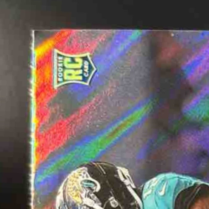 2025 Panini PhotoGenic Travis Hunter Orange /65 #137 RC Jacksonville Jaguars