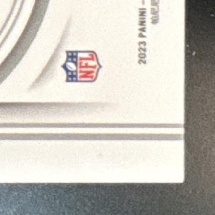 2023 National Treasures Dontayvion Wicks Purple /49 Auto RC Green Bay Packers